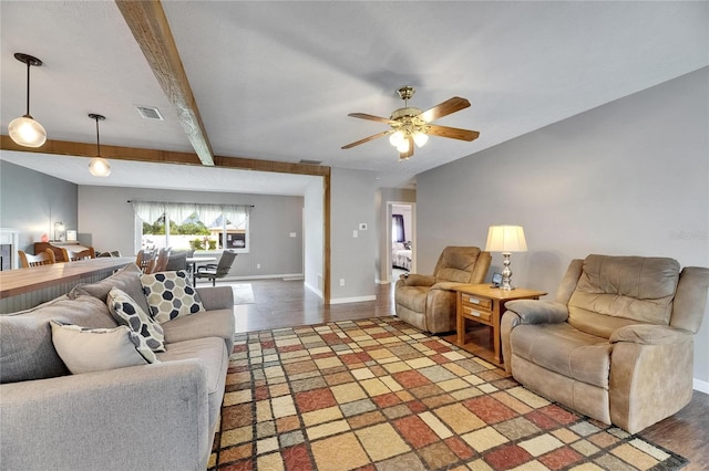 2914 Forest Cir, Seffner, FL 33584 - living area with wood finished floors, a ceiling fan, and beamed ceiling