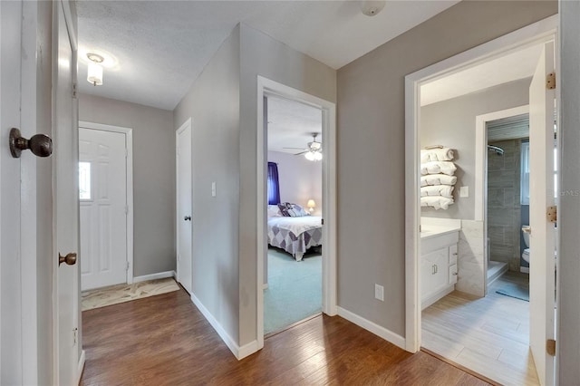 2914 Forest Cir, Seffner, FL 33584 - hallway with wood finished floors and baseboards