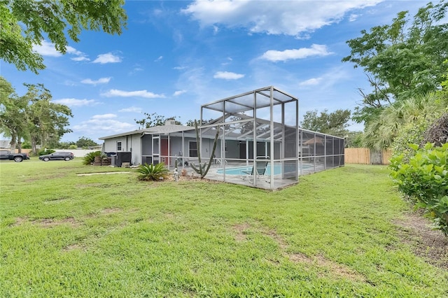 2914 Forest Cir, Seffner, FL 33584 - back of property with an outdoor pool and glass enclosure