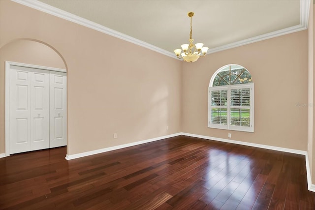 13321 Lewis Raulerson Rd, Dover, FL 33527 - empty room featuring a chandelier, dark wood finished floors, and ornamental molding