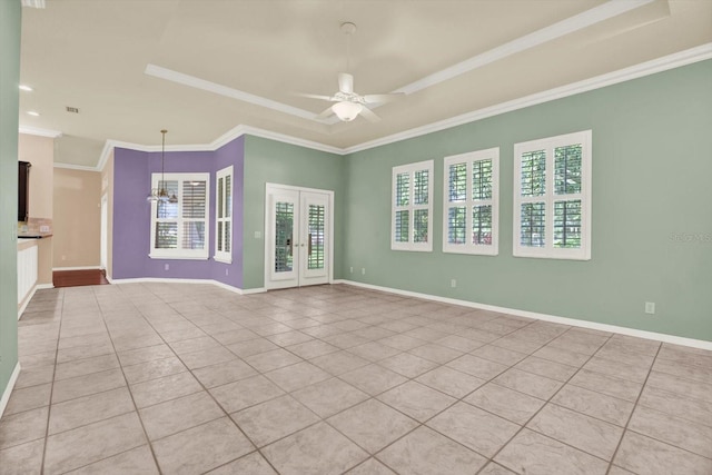 13321 Lewis Raulerson Rd, Dover, FL 33527 - spare room featuring a raised ceiling, light tile patterned flooring, a ceiling fan, crown molding, and french doors