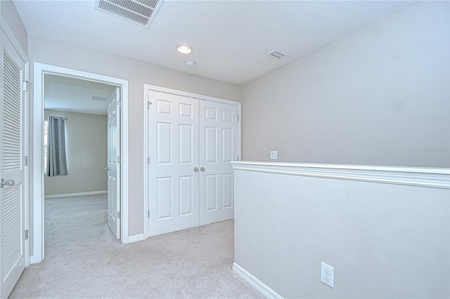 7077 Woodchase Glen Dr, Riverview, FL 33578 - hallway featuring light colored carpet and baseboards
