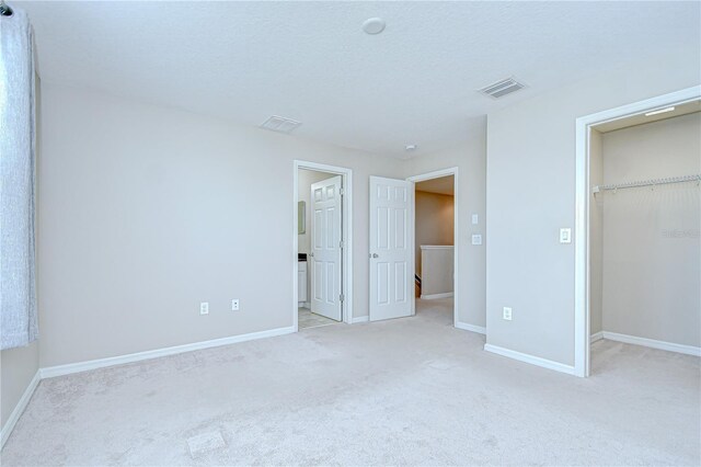 7077 Woodchase Glen Dr, Riverview, FL 33578 - unfurnished bedroom with carpet, a spacious closet, and a closet