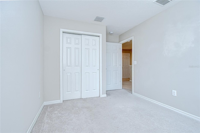 7077 Woodchase Glen Dr, Riverview, FL 33578 - unfurnished bedroom with carpet flooring and a closet