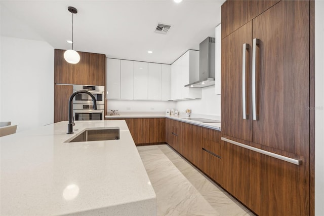 777 3rd Ave N Unit 1406, Saint Petersburg, FL 33701 - kitchen featuring paneled built in refrigerator, wall chimney exhaust hood, modern cabinets, white cabinetry, and recessed lighting