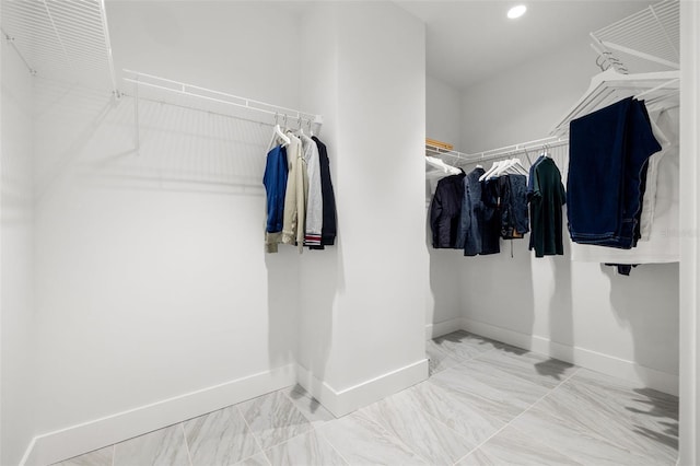 777 3rd Ave N Unit 1406, Saint Petersburg, FL 33701 - walk in closet featuring marble look tile flooring