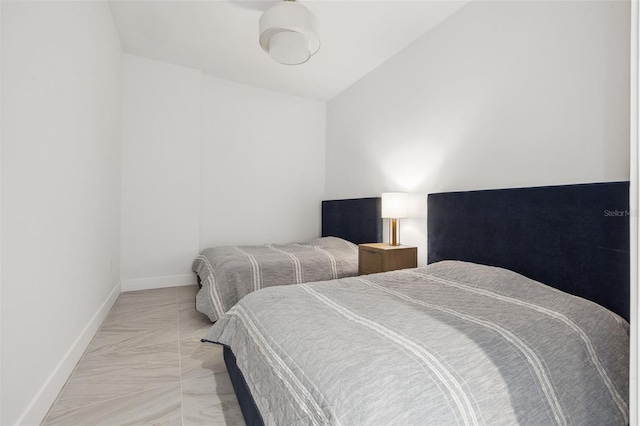777 3rd Ave N Unit 1406, Saint Petersburg, FL 33701 - bedroom with baseboards and light marble finish flooring