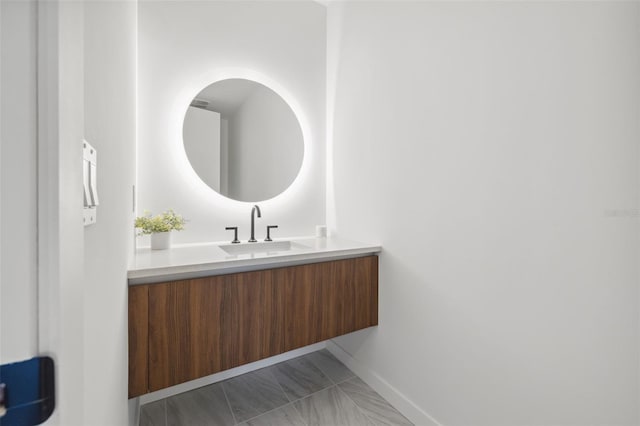 777 3rd Ave N Unit 1406, Saint Petersburg, FL 33701 - bathroom featuring baseboards and vanity