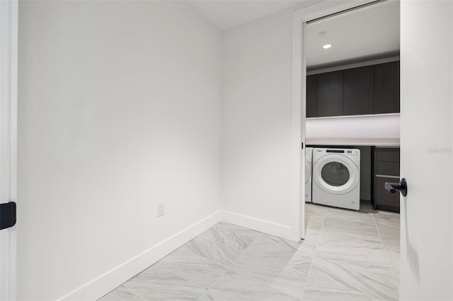 777 3rd Ave N Unit 1406, Saint Petersburg, FL 33701 - washroom with washer / dryer, light marble finish flooring, cabinet space, and recessed lighting