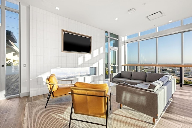 777 3rd Ave N Unit 1406, Saint Petersburg, FL 33701 - living room featuring floor to ceiling windows and wood finished floors