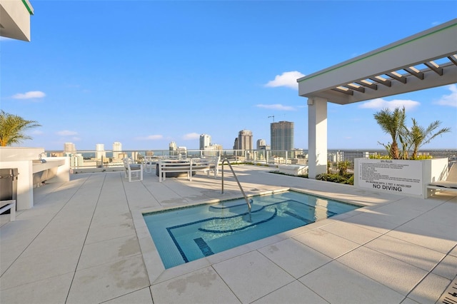 777 3rd Ave N Unit 1406, Saint Petersburg, FL 33701 - view of swimming pool featuring a pool, a patio area, and a view of skyline