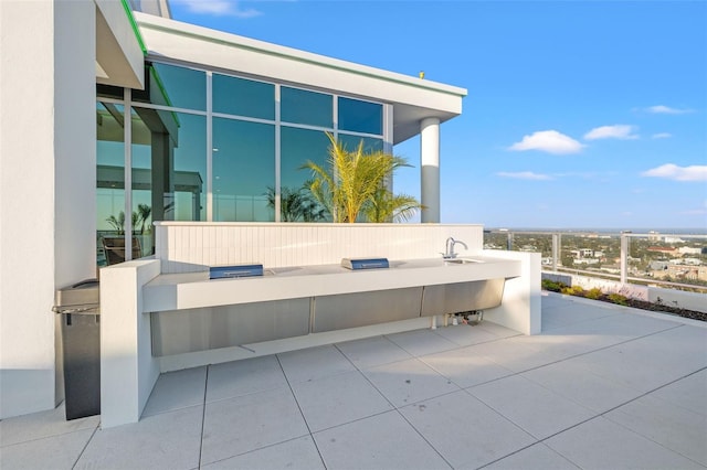 777 3rd Ave N Unit 1406, Saint Petersburg, FL 33701 - view of patio with area for grilling and a sink