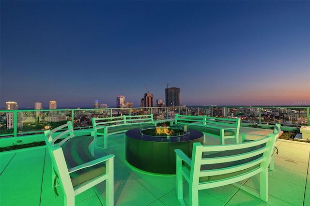 777 3rd Ave N Unit 1406, Saint Petersburg, FL 33701 - view of patio with an outdoor fire pit and a city view