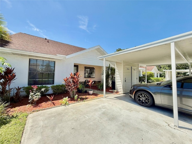 10636 Millriver Dr, New Port Richey, FL 34654 - view of front of property with an attached carport and concrete driveway