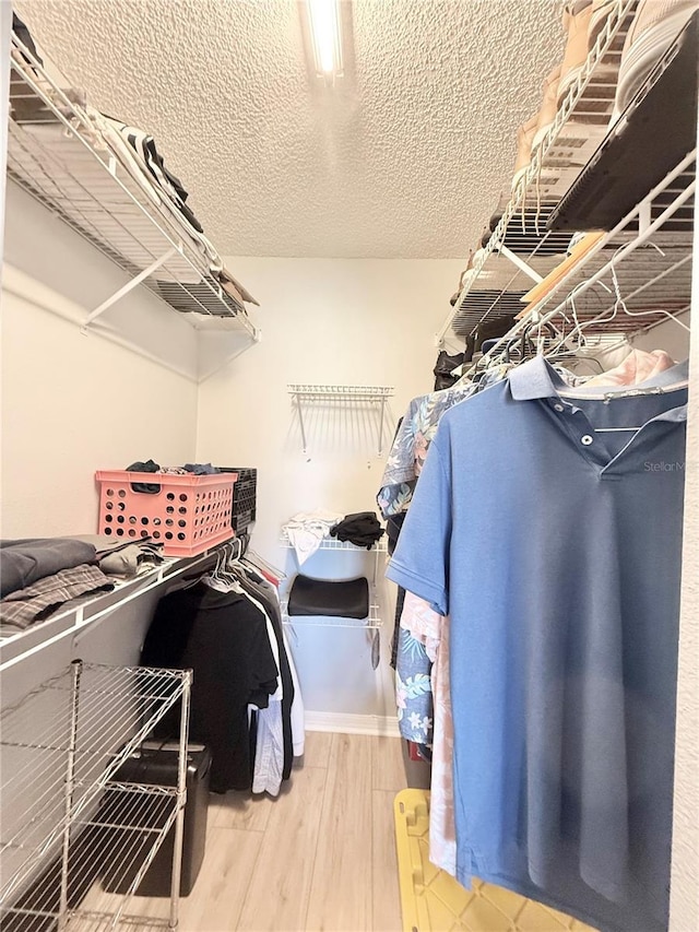 10636 Millriver Dr, New Port Richey, FL 34654 - walk in closet featuring wood finished floors
