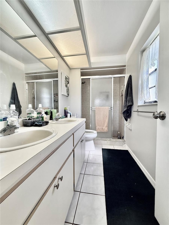 10636 Millriver Dr, New Port Richey, FL 34654 - full bath featuring double vanity, a stall shower, and tile patterned floors