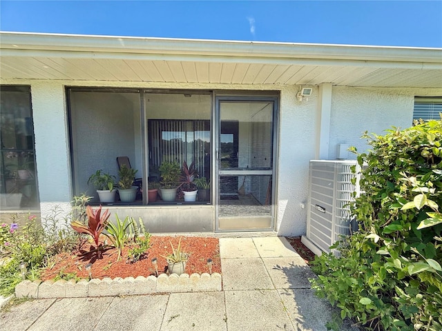 10636 Millriver Dr, New Port Richey, FL 34654 - doorway to property featuring stucco siding