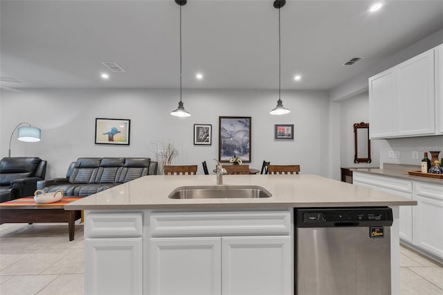5813 Grand Sonata Ave, Lutz, FL 33558 - kitchen with stainless steel dishwasher, light tile patterned floors, open floor plan, recessed lighting, and white cabinets