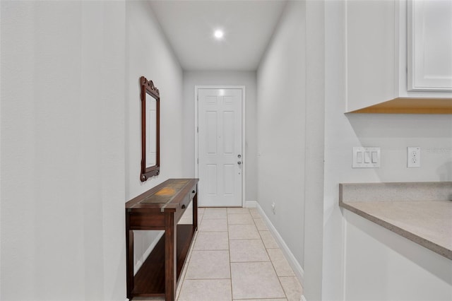 5813 Grand Sonata Ave, Lutz, FL 33558 - entryway featuring light tile patterned floors and baseboards