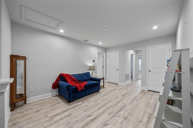 5813 Grand Sonata Ave, Lutz, FL 33558 - living area featuring light wood finished floors, attic access, and recessed lighting
