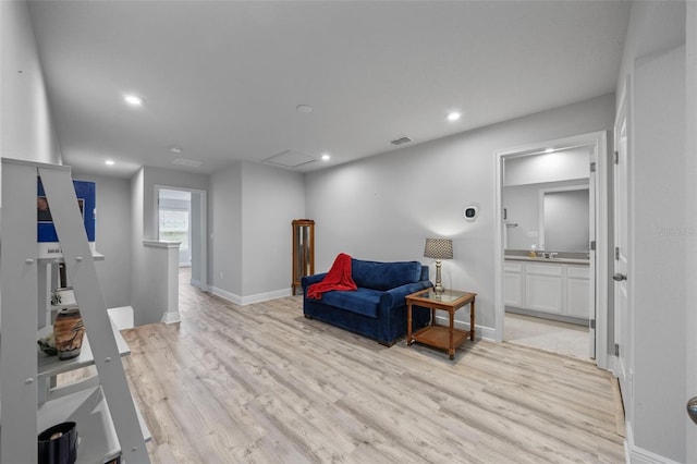 5813 Grand Sonata Ave, Lutz, FL 33558 - living area featuring an upstairs landing, light wood-type flooring, and recessed lighting