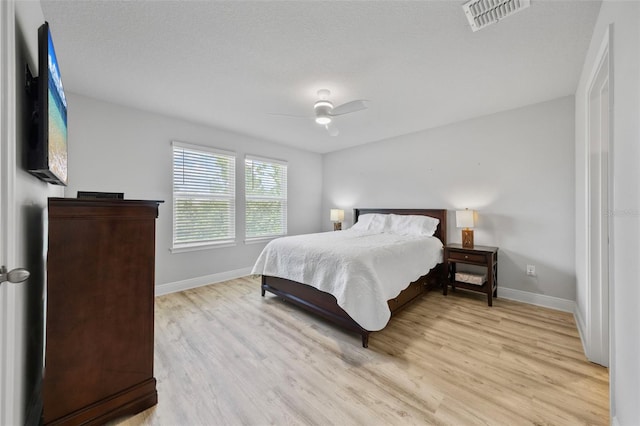 5813 Grand Sonata Ave, Lutz, FL 33558 - bedroom featuring light wood finished floors and a ceiling fan