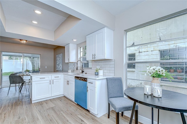 6720 Gilda Dr, Tampa, FL 33625 - kitchen with dishwasher, white cabinetry, plenty of natural light, light wood-style flooring, and recessed lighting