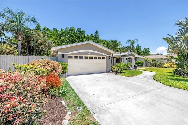 4096 38th St S, Saint Petersburg, FL 33711 - ranch-style home featuring a garage, concrete driveway, and stucco siding