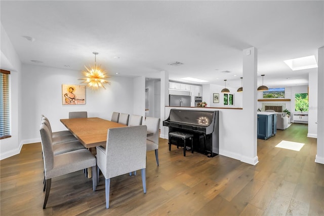 4096 38th St S, Saint Petersburg, FL 33711 - dining room with wood finished floors, recessed lighting, and a skylight