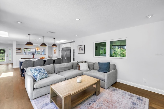 4096 38th St S, Saint Petersburg, FL 33711 - living room with light wood-style flooring, recessed lighting, and a textured ceiling