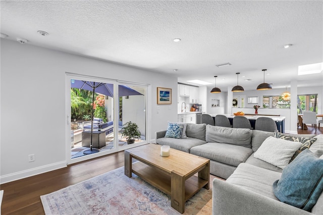 4096 38th St S, Saint Petersburg, FL 33711 - living room with a textured ceiling, wood finished floors, and recessed lighting