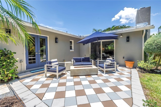 4096 38th St S, Saint Petersburg, FL 33711 - view of patio / terrace with french doors and an outdoor living space with a fire pit