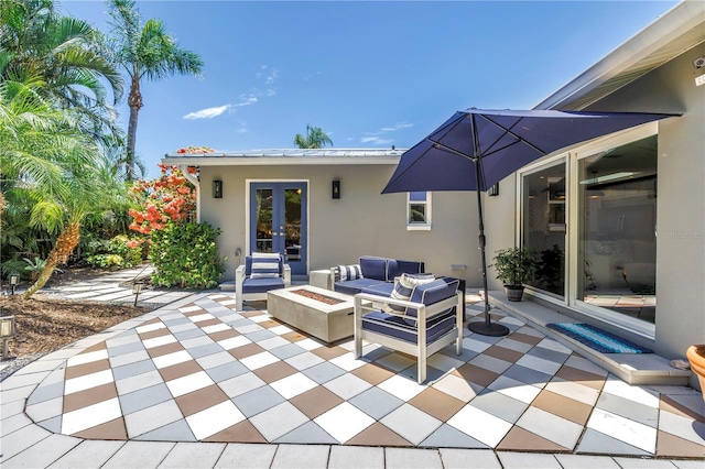 4096 38th St S, Saint Petersburg, FL 33711 - view of patio with french doors and an outdoor living space with a fire pit