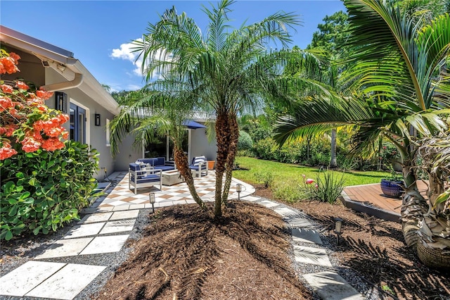 4096 38th St S, Saint Petersburg, FL 33711 - view of green lawn with outdoor lounge area and a patio area