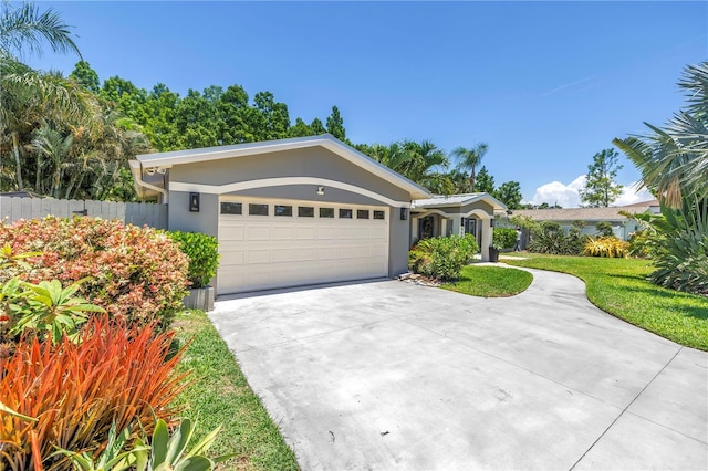 4096 38th St S, Saint Petersburg, FL 33711 - ranch-style home featuring a garage, concrete driveway, and stucco siding