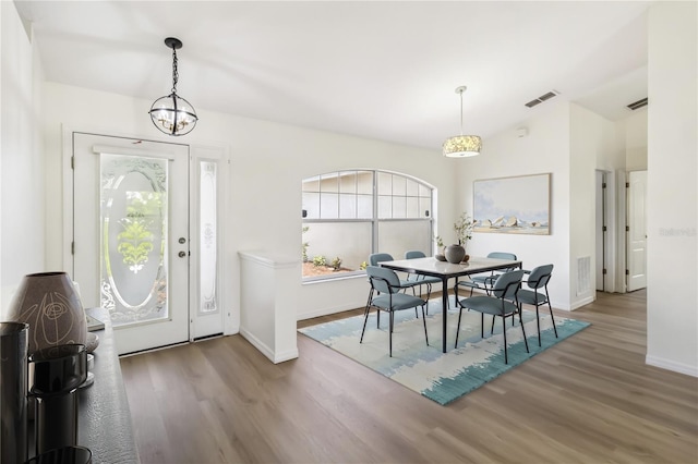 818 Cherry Laurel St, Minneola, FL 34715 - foyer with healthy amount of natural light, wood finished floors, and a chandelier