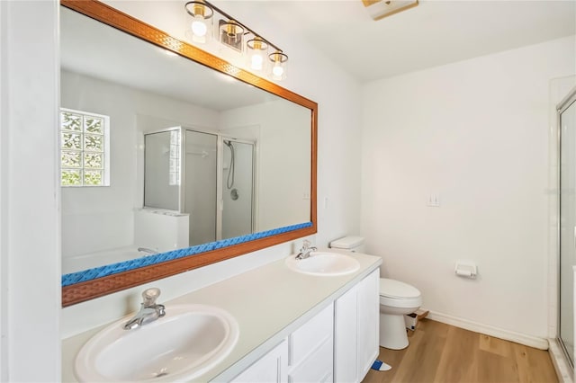 818 Cherry Laurel St, Minneola, FL 34715 - full bath featuring a stall shower, double vanity, and wood finished floors
