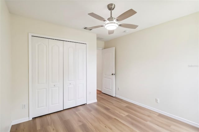818 Cherry Laurel St, Minneola, FL 34715 - unfurnished bedroom featuring light wood-type flooring, a closet, and ceiling fan