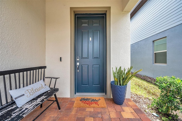 18144 Frame Bnd, Land O Lakes, FL 34638 - entrance to property with stucco siding