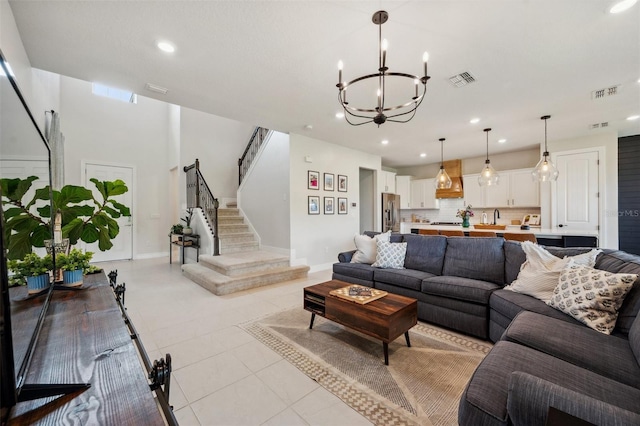 18144 Frame Bnd, Land O Lakes, FL 34638 - living room featuring a chandelier, recessed lighting, stairway, and light tile patterned flooring