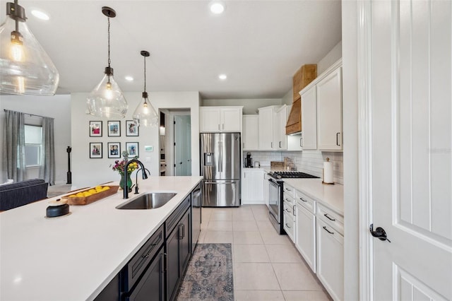 18144 Frame Bnd, Land O Lakes, FL 34638 - kitchen featuring appliances with stainless steel finishes, light countertops, white cabinets, decorative backsplash, and hanging light fixtures