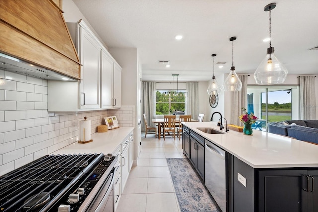 18144 Frame Bnd, Land O Lakes, FL 34638 - kitchen with stainless steel dishwasher, range with gas stovetop, custom range hood, light countertops, and recessed lighting