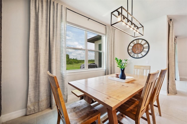 18144 Frame Bnd, Land O Lakes, FL 34638 - dining room featuring a chandelier and light tile patterned flooring