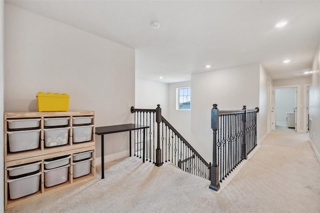 18144 Frame Bnd, Land O Lakes, FL 34638 - hall featuring an upstairs landing, carpet flooring, and recessed lighting