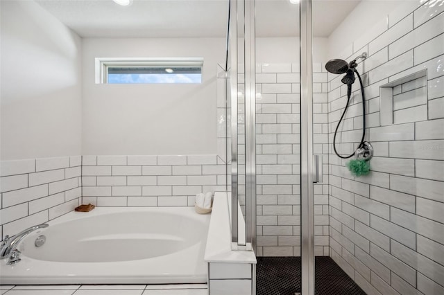18144 Frame Bnd, Land O Lakes, FL 34638 - bathroom featuring a stall shower and a bath