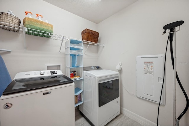 18144 Frame Bnd, Land O Lakes, FL 34638 - laundry room featuring washer and clothes dryer and baseboards