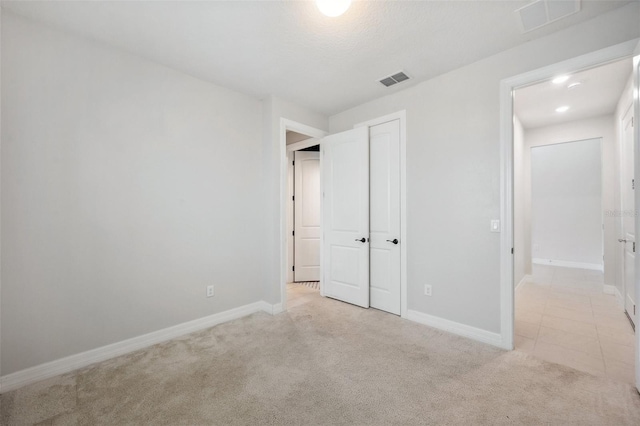 18144 Frame Bnd, Land O Lakes, FL 34638 - unfurnished bedroom with light colored carpet and a closet