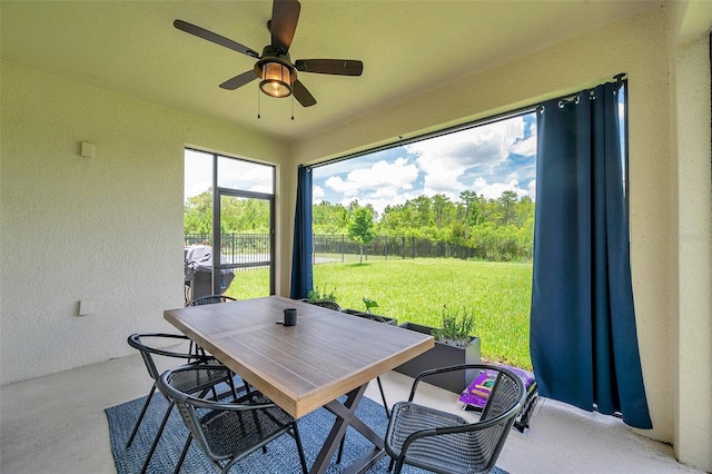 18144 Frame Bnd, Land O Lakes, FL 34638 - sunroom featuring outdoor dining space and a ceiling fan