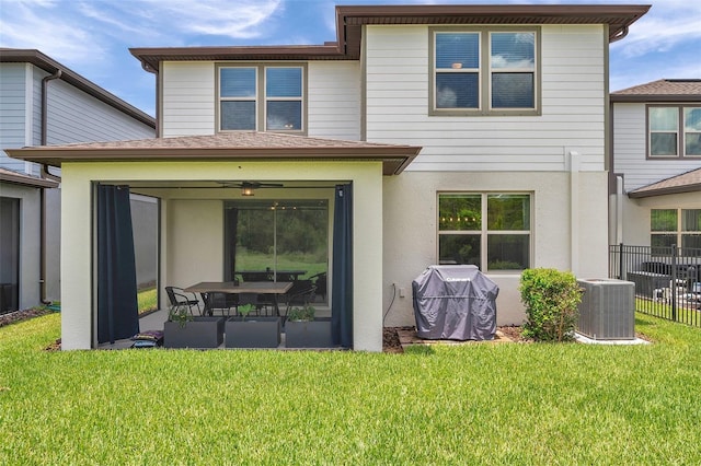18144 Frame Bnd, Land O Lakes, FL 34638 - rear view of property featuring stucco siding and roof with shingles