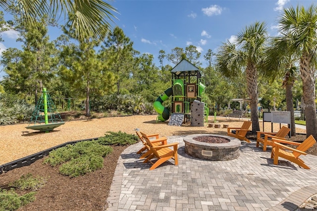 18144 Frame Bnd, Land O Lakes, FL 34638 - view of patio / terrace featuring a playground and a fire pit